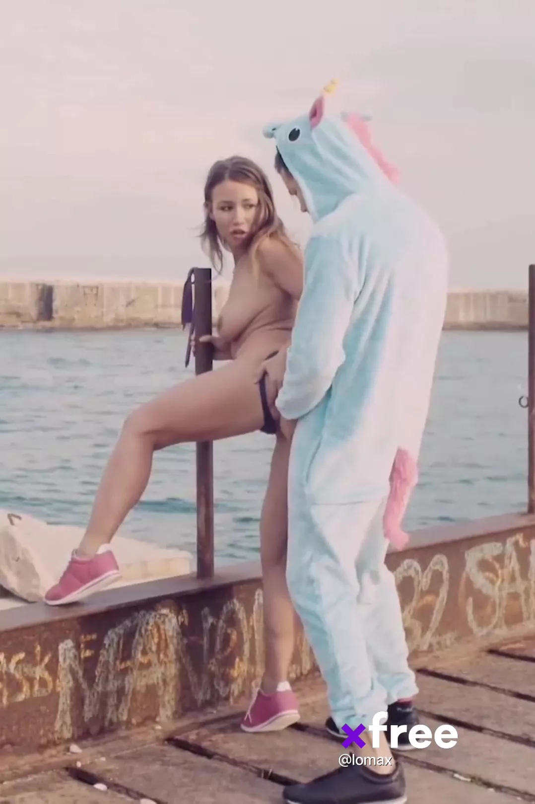 A lass is taking a good cock ride from a bloke in a bizarre unicorn costume.