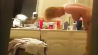 Wife applying skin lotion after a shower